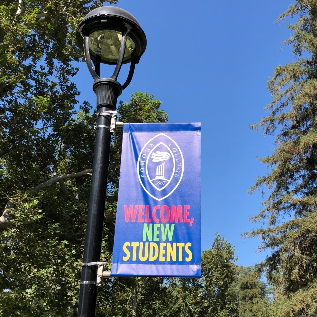 Lamp post banner with the inscription: Pomona College, Welcome, New Students